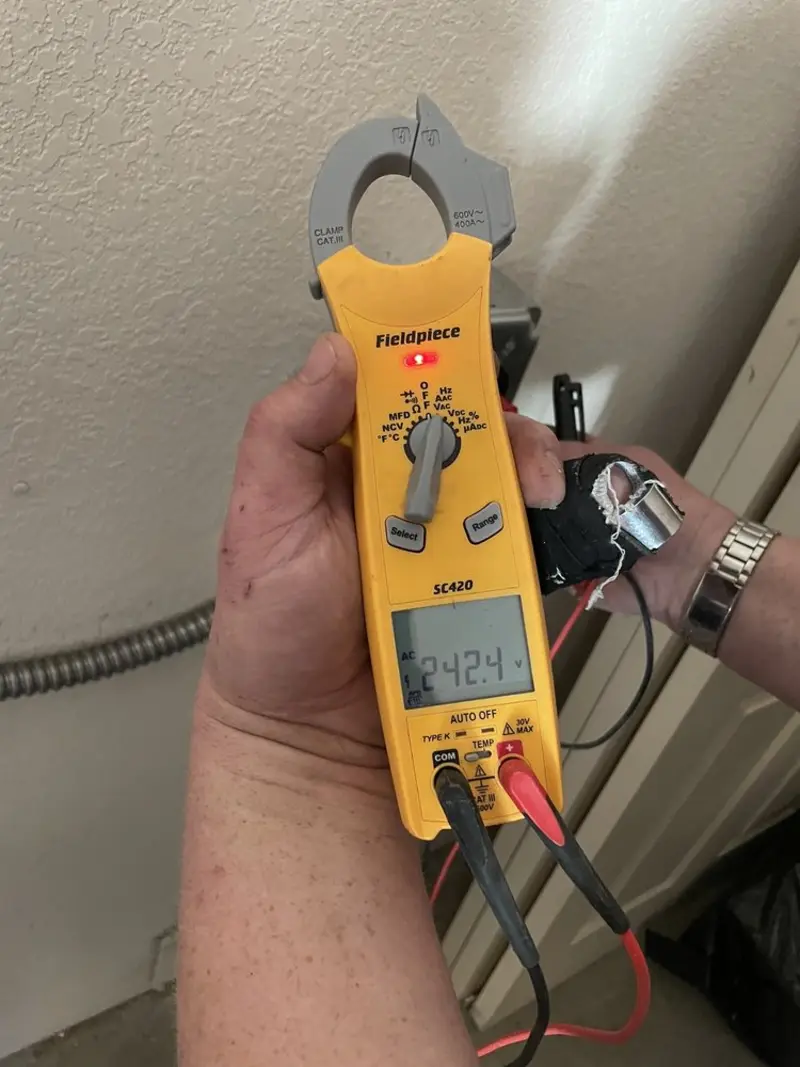 Voltage testing with clamp meter during Recessed Lighting Installation in Midland